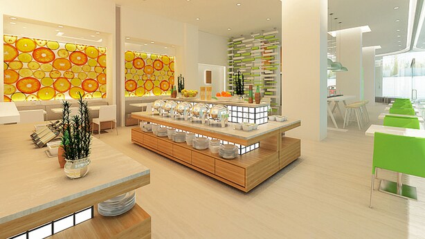 A modern interior with a central counter, seating areas, and decorative walls. - Zest Ambon by Swiss-Belhotel International (Ambon)