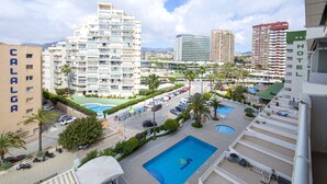 A hotel with multiple floors, a swimming pool, and a view of surrounding buildings. - Esmeralda by Interhome (Calpe/Calp)