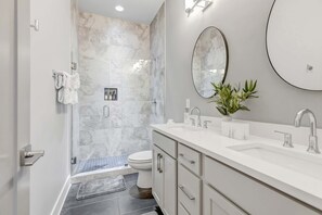 Shower, hair dryer, towels, shampoo