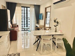 Luxury Apartment, Park View | Living area | 60-inch flat-screen TV with cable channels - Vinhomes Grand Park Luxury Apartments  (Ho Chi Minh City)