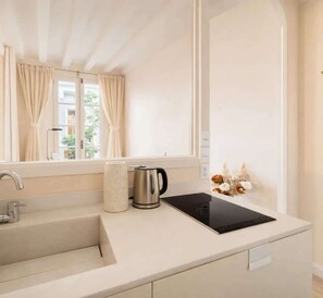 Fridge, microwave, stovetop, coffee/tea maker