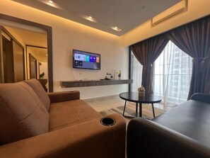 2-Bedroom Apartment | Living area | 50-inch Smart TV with cable channels, Netflix, streaming services