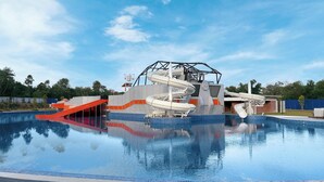 A swimming pool with a water slide and a red ramp. - Quest Hotel Midport Port Dickson (Port Dickson)