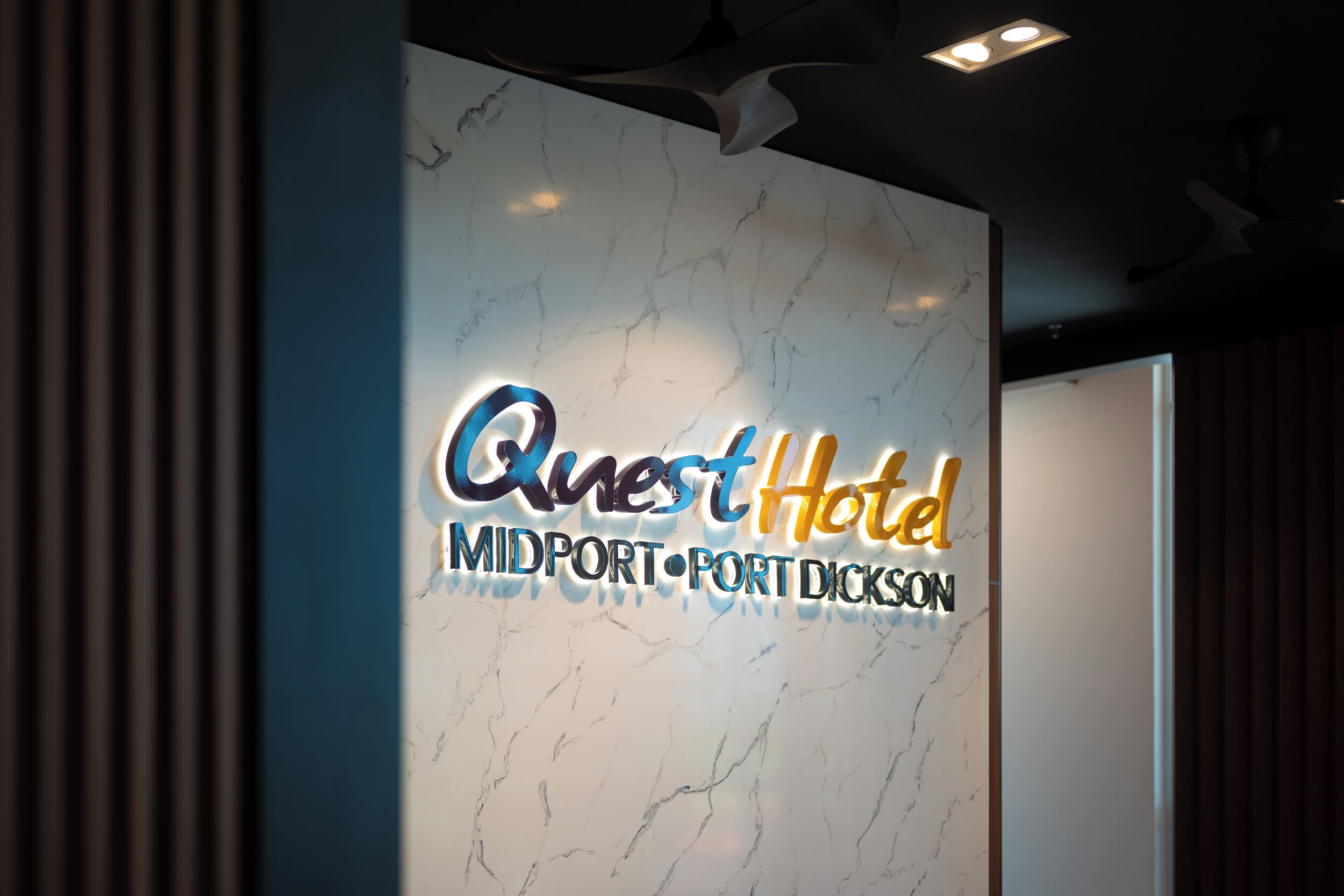 A sign for Quest Hotel in Midport, Port Dickson.