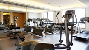 A modern gym with various cardio machines, free weights, and dumbbells. - Pagoda Hotel Shanghai Baixia near Jingan Temple (Shanghai)