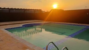 A swimming pool at sunset with clear skies. - Lorateng' Resort Rusinga (Rusinga Island)
