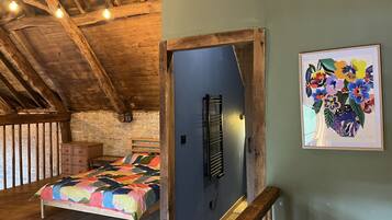 1 bedroom, desk, iron/ironing board, travel crib