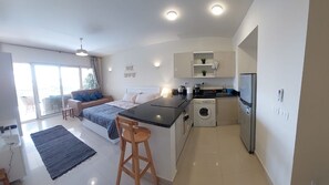 Fridge, microwave, stovetop, coffee/tea maker