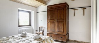 GuestHost - Charming independent farmhouse of about 100 sqm, perfect for 4 people, structured on two levels (second floor accessible by stairs).The property is a Rustico dating back to the 19th century, completely renovated, and is located in the heart o