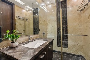 Deluxe Apartment | Bathroom | Shower, rainfall showerhead, free toiletries, slippers - Geet by Akama Homes (New Delhi)