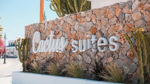 A stone wall with the text "Cadivi suites" indicating a hotel or accommodation establishment. - Cactus Suites  (Faliraki)
