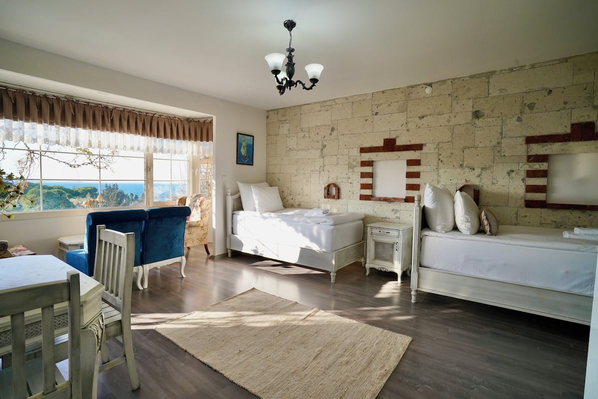 Family Suite, Sea Facing | Living area | 32-inch flat-screen TV with cable channels
