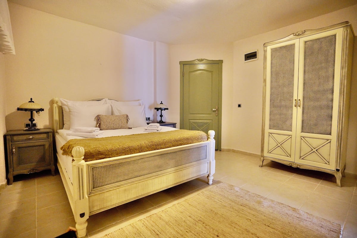 Family Suite, Garden Area | 2 bedrooms, premium bedding, minibar, in-room safe