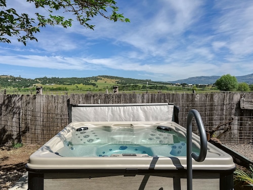 Unwind in this stylish, fully remodeled farmhouse with mountain views and a private hot tub