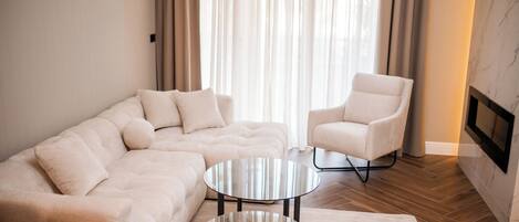 Royal Apartment, Balcony, City View | Living area | 64-inch LED TV with satellite channels