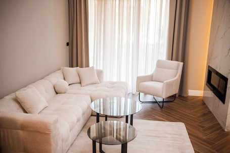 Royal Apartment, Balcony, City View | Living area | 64-inch LED TV with satellite channels