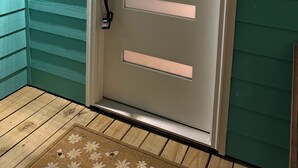 A door with a modern design, featuring horizontal panels and a keyhole lock. - AZURE beach villa at Galveston  (Galveston)