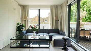 Apartment | Living area | 50-inch flat-screen TV with digital channels