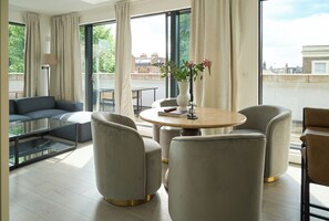 Apartment | Living area | 50-inch flat-screen TV with digital channels