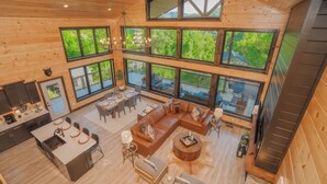 A spacious interior with a large dining area, a cozy seating area, and a kitchen.