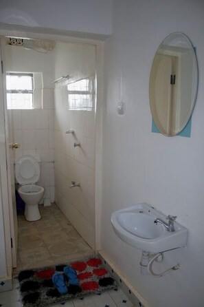 Shower, slippers, towels, soap