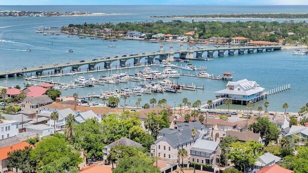 A coastal town with a marina, a bridge, and residential buildings. - Cordova Palms - 4BR near Castillo w/ BBQ (St. Augustine)