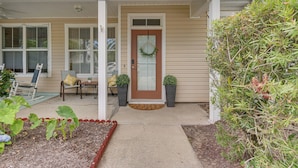 A front porch with a door, a bench, and potted plants. - 1 Mi to Dtwn Bluffton: Historic District Retreat (Bluffton)