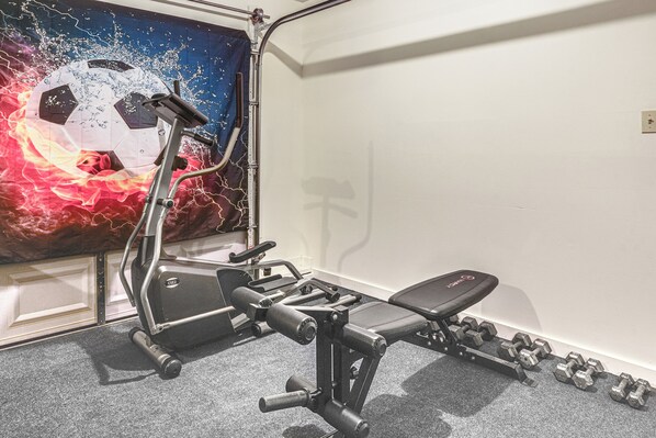 A gym with exercise equipment, a bench, and dumbbells. - 4 Mi to Massanutten Resort: Family Home w/ Views! (McGaheysville)