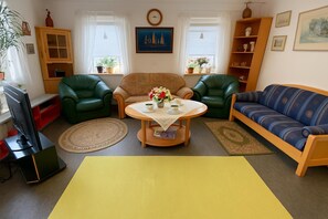 Standard House, Multiple Bedrooms (Charming Swedish Summer Cottage) | Living area | 21-inch Smart TV with cable channels - Charming Swedish Summer Cottage (Motala)