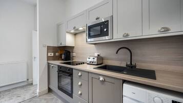 Fridge, microwave, toaster, cookware/dishes/utensils