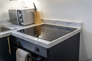 Oven, toaster, dining tables