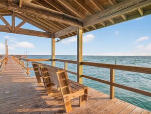A wooden pier extending into the sea with benches along the walkway. - The Salty Seahorse Rryc 36 3 Bedroom Condo (Rockport)