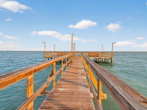 A wooden pier extending into calm waters with a clear sky. - The Salty Seahorse Rryc 36 3 Bedroom Condo (Rockport)