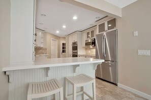 Villa, Multiple Beds, Kitchen, Pool View (32 Turtle Lane) | Private kitchen | Coffee/tea maker, dining tables - 32 Turtle Lane at The Sea Pines Resort (Hilton Head Island)