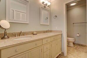 A bathroom with two sinks, a mirror, and a toilet. - 459 Plantation Club Villas at The Sea Pines Resort (Hilton Head Island)