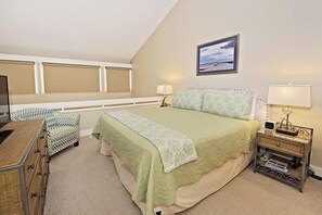 A bedroom with a bed, bedside tables, a dresser, and a window with blinds. - 259 Stoney Creek Villa at The Sea Pines Resort (Hilton Head Island)