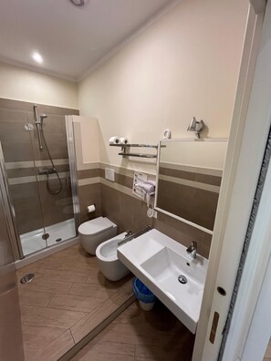 Shower, free toiletries, hair dryer, towels