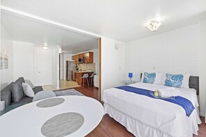 Cozy bed with tropical accents and elegant lighting