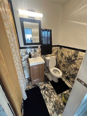 Shower, towels, soap, toilet paper