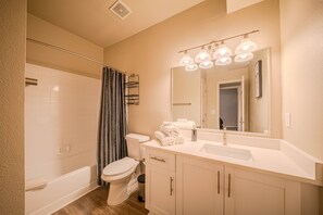 Shower, hair dryer, towels, toilet paper