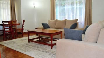 Appartement Deluxe, vue ville | Coin séjour