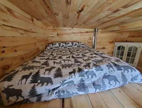 1 bedroom, bed sheets. Bright and Cozy Tiny Pine House