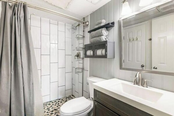 Hair dryer, towels, soap, toilet paper