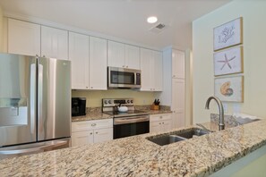 Villa, 1 King Bed with Sofa bed, Kitchen, Garden View (2370 Racquet Club) | Private kitchen | Coffee/tea maker, dining tables