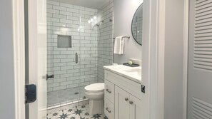 A bathroom with a shower, toilet, and sink. - 2244 Heritage Villas at The Sea Pines Resort (Hilton Head Island)