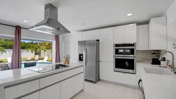 Family House, Pool View | Private kitchen | Coffee/tea maker, electric kettle, highchair