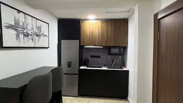 Family Apartment, Balcony, City View | Private kitchen | Fridge, microwave, oven, stovetop