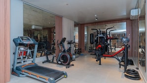 A gym with treadmills, stationary bikes, and weight machines. - Royal Palace Compound (Riyadh)