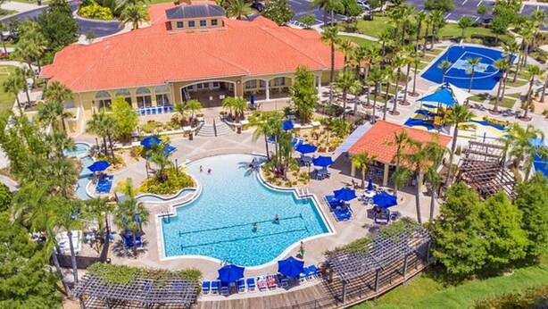 A resort with a central swimming pool, multiple buildings, and a surrounding landscaped area. - Luxury Florida Villa with Private Pool - Free Heating (Kissimmee)