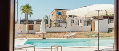 Outdoor pool, pool umbrellas, sun loungers